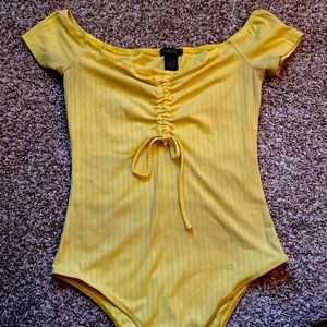 Yellow off the shoulder body suit
